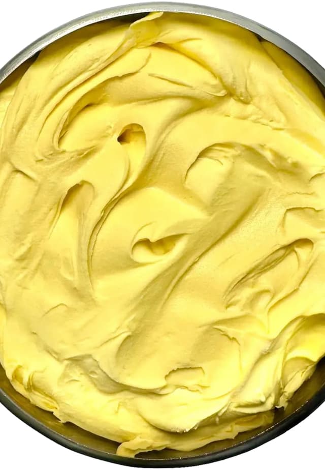 Golden yellow mango sorbet, smooth and freshly spatulated